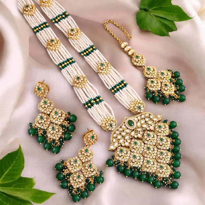 classic gemstone stud earrings Emerald Dhruvi Kundan Jewellery Set